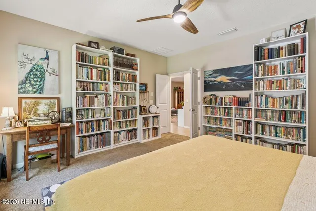 a kitchen with stainless steel appliances granite countertop a kitchen island a stove a sink dishwasher a dining table and chairs with wooden floor