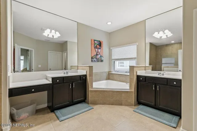 a kitchen with stainless steel appliances granite countertop a stove microwave and refrigerator