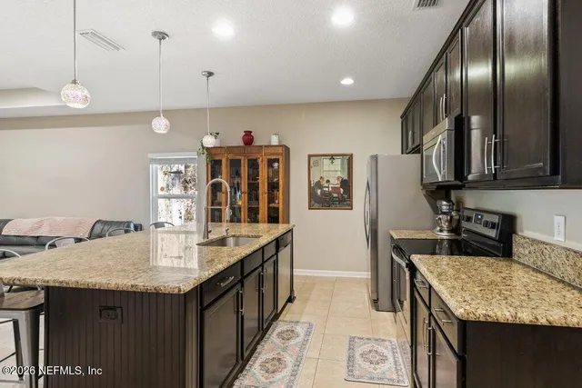 a view of a room with wooden floor and windows