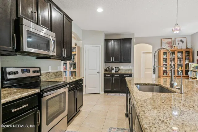 a swimming pool with trees in the background