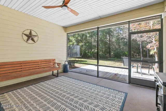 a view of a swimming pool with a yard