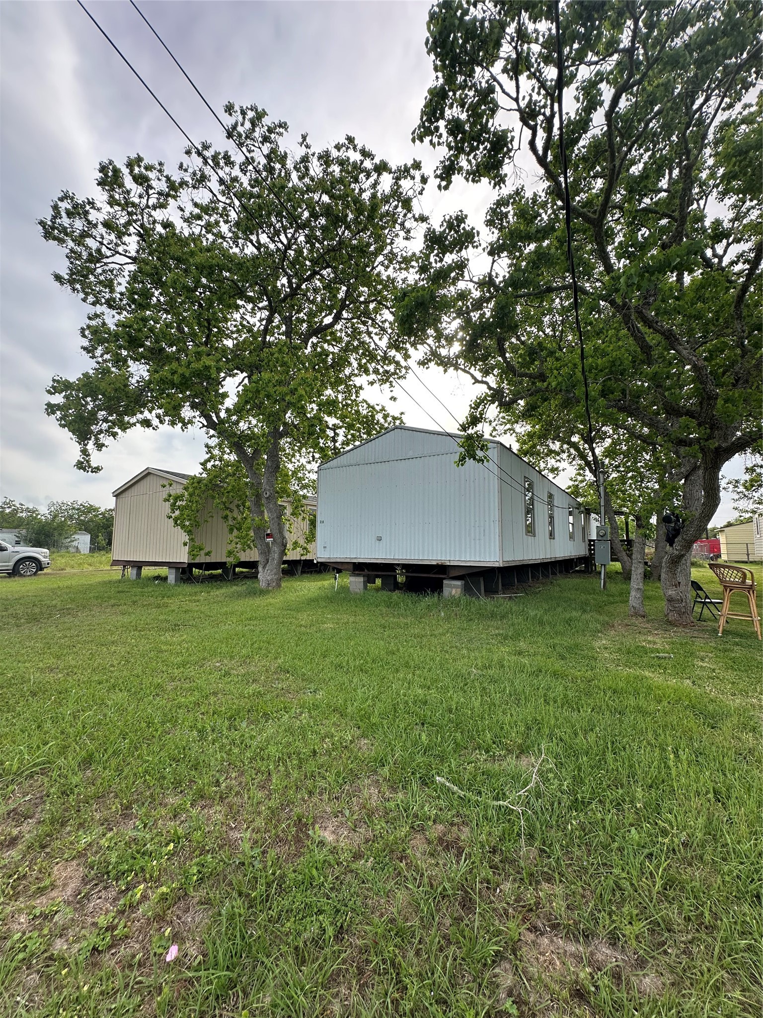 318 4th Street San Leon, TX 77539 - Photo 1 of 10 a view of a yard with a house and garden