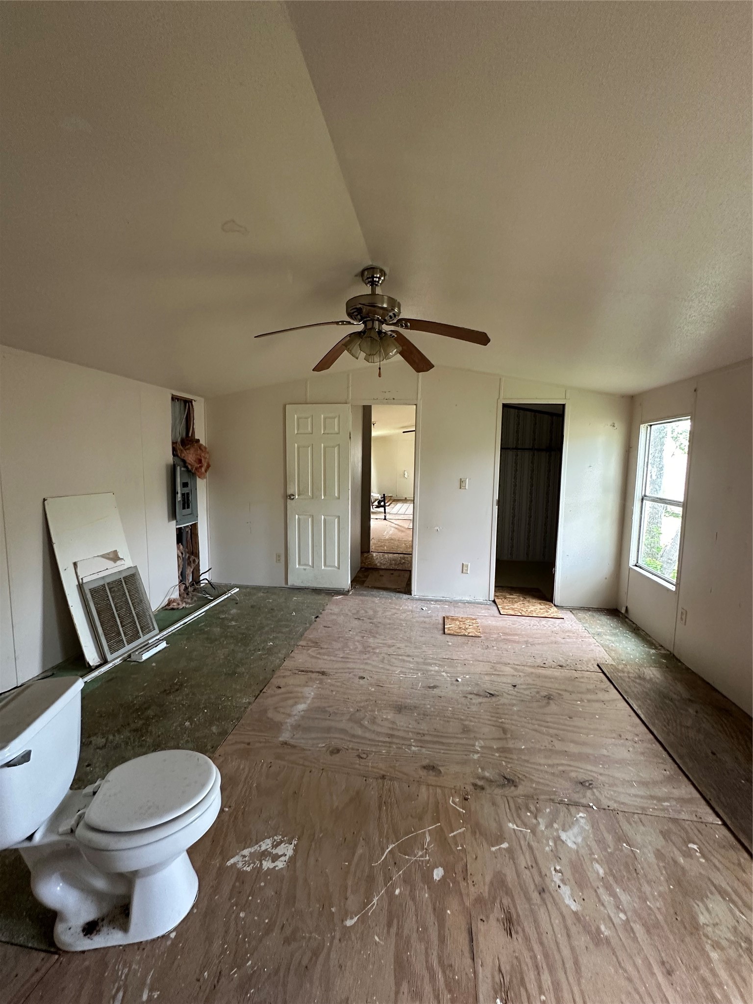 318 4th Street San Leon, TX 77539 - Photo 5 of 10 a spacious bedroom with a bed and a chandelier