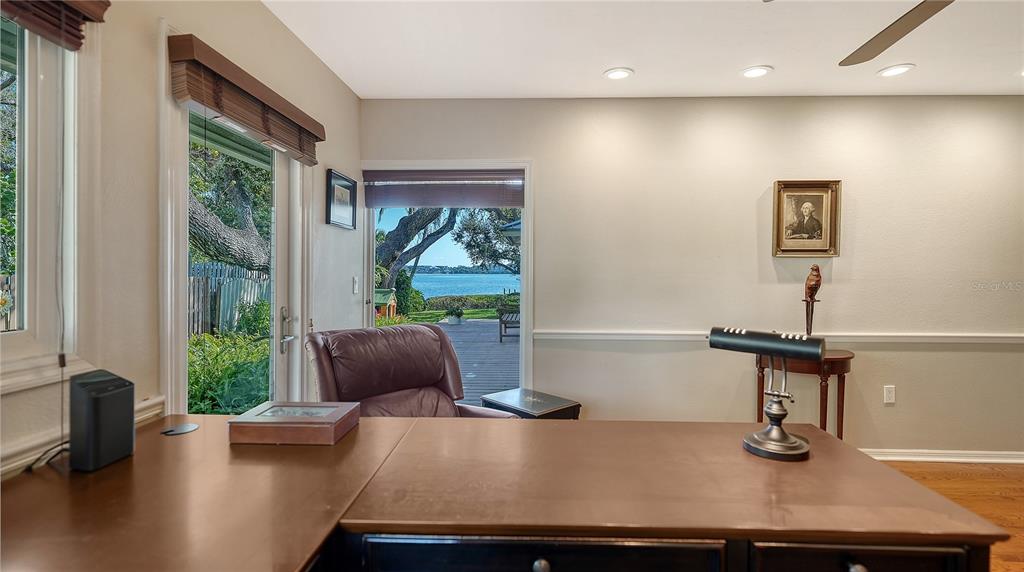 1042 North Casey Key Road Nokomis, FL 34275 - Photo 24 of 77 a room with furniture and a window