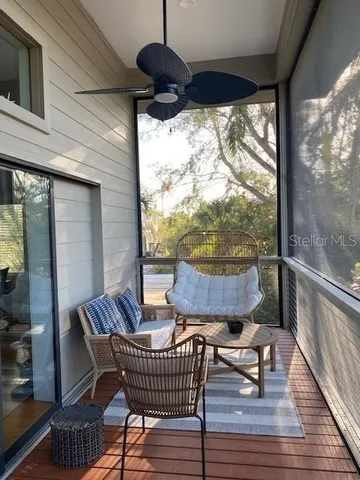 a view of balcony with furniture