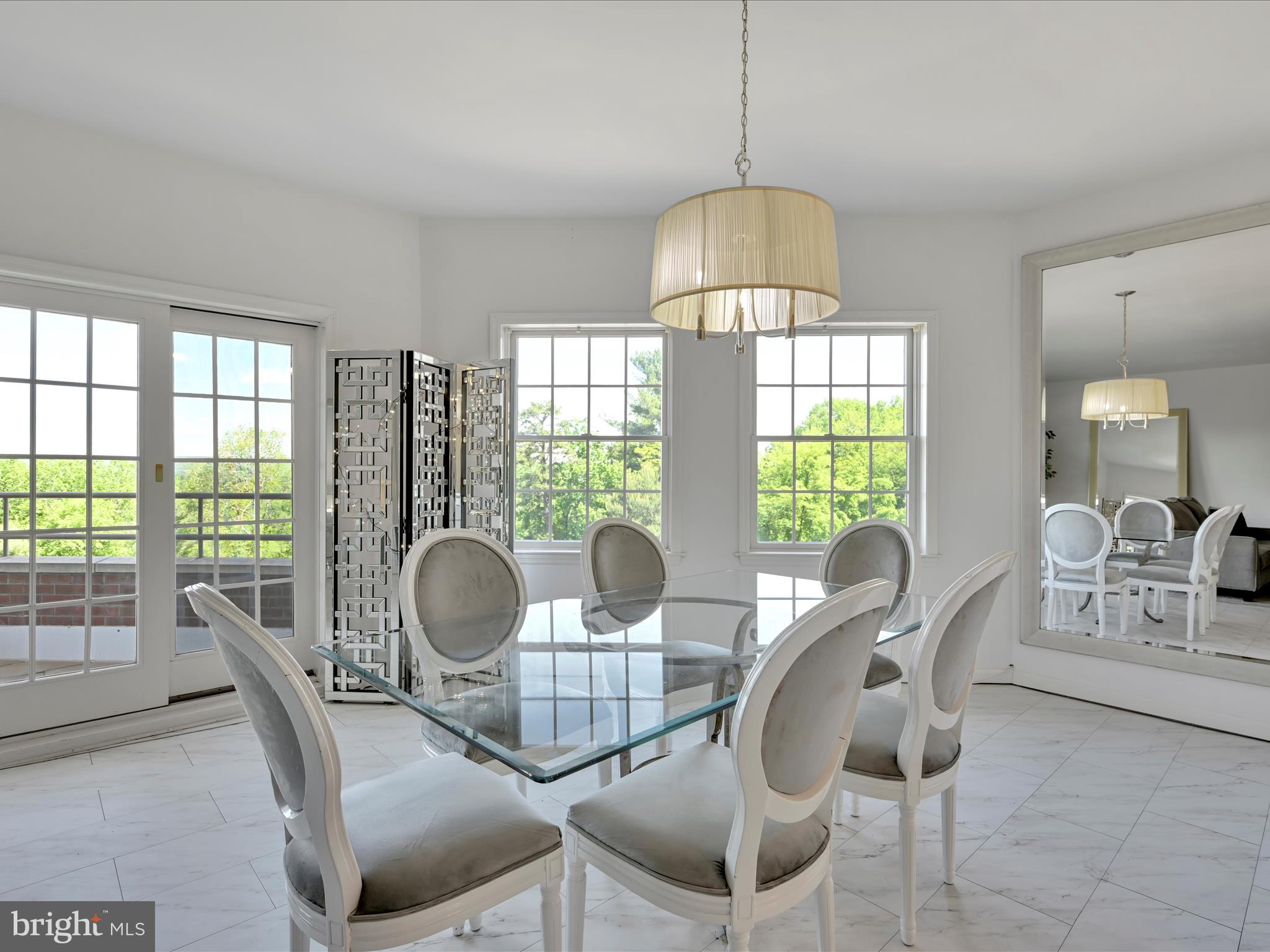 2415 Sharp Mountain Road Pottsville, PA 17901 - Photo 11 of 36 a dining room with furniture a chandelier and wooden floor