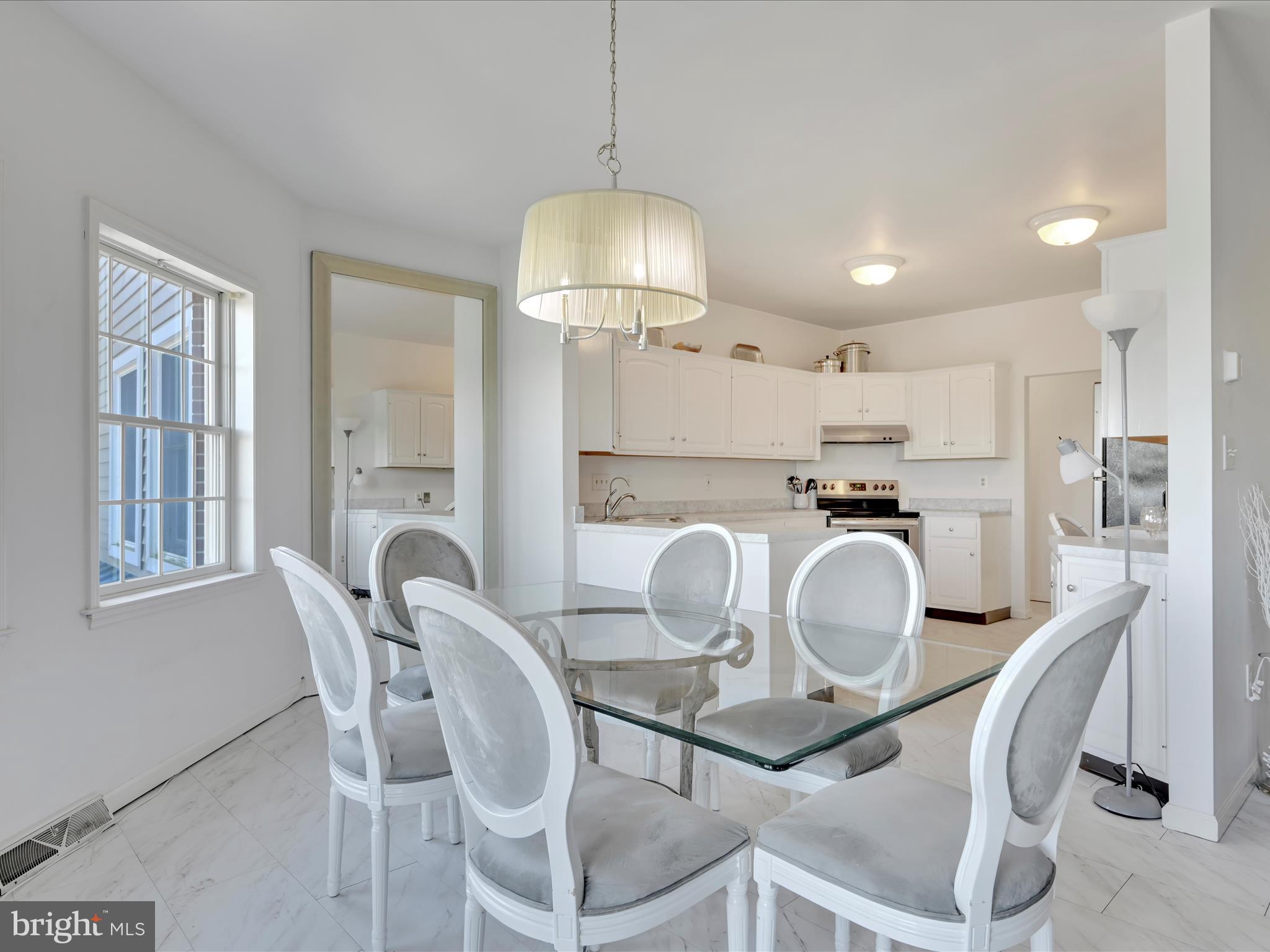 2415 Sharp Mountain Road Pottsville, PA 17901 - Photo 12 of 36 a kitchen with stainless steel appliances granite countertop a dining table chairs and a refrigerator
