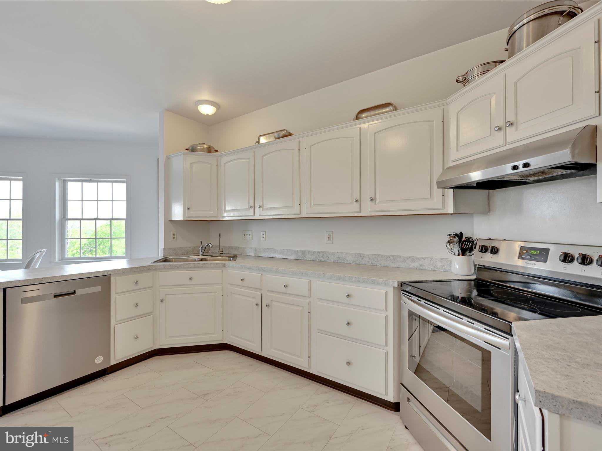 2415 Sharp Mountain Road Pottsville, PA 17901 - Photo 13 of 36 a kitchen with granite countertop white cabinets and stainless steel appliances