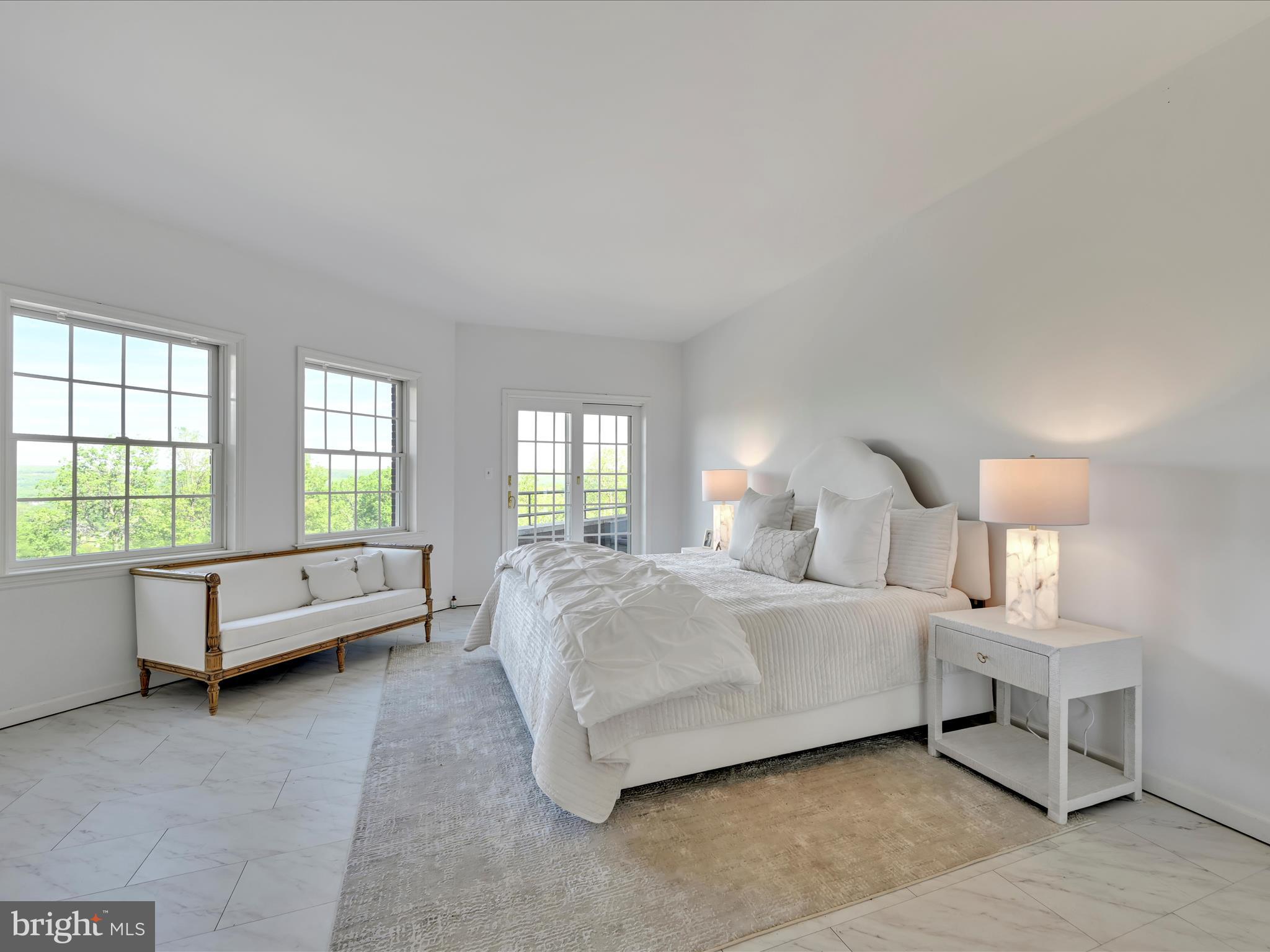 2415 Sharp Mountain Road Pottsville, PA 17901 - Photo 18 of 36 a spacious bedroom with a bed and a couch