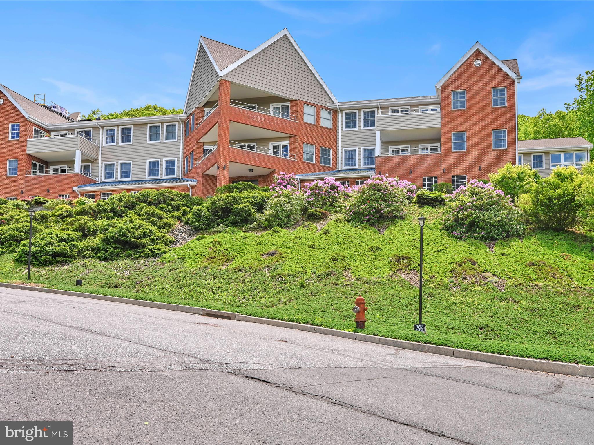 2415 Sharp Mountain Road Pottsville, PA 17901 - Photo 2 of 36 a front view of a house with a yard and potted plants