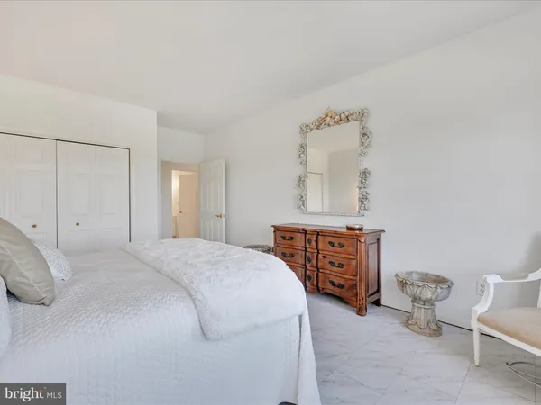 a bedroom with a bed and cabinets