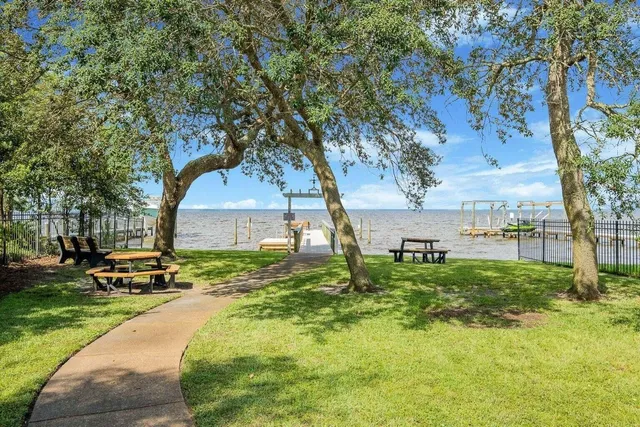 a view of a lake with outdoor seating