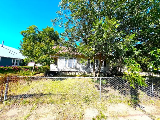 a view of a house with swimming pool