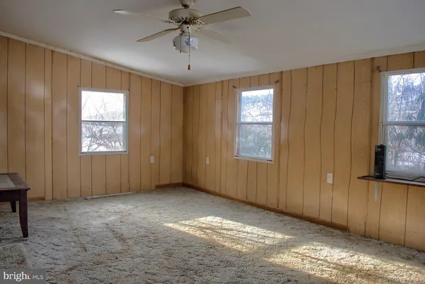 a view of livingroom with furniture and windows