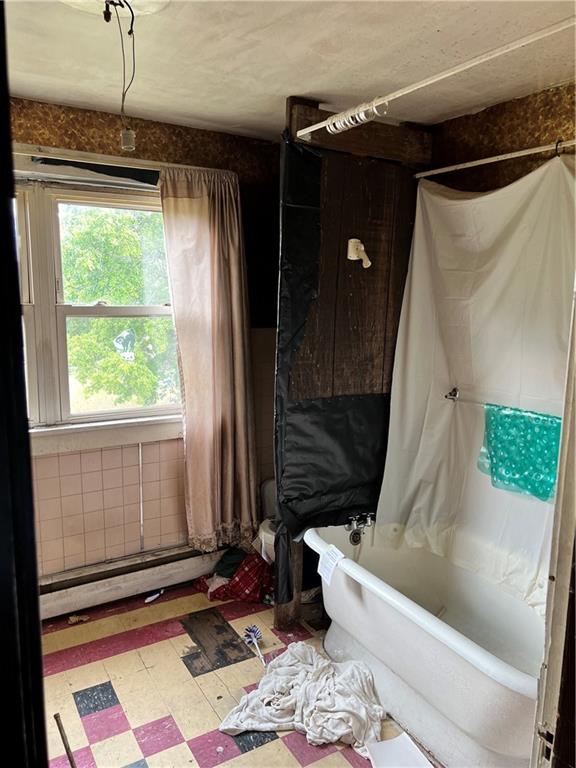 612 Highway 31 Ruffs Dale, PA 15679 - Photo 11 of 18 a bathroom with a bathtub and shower