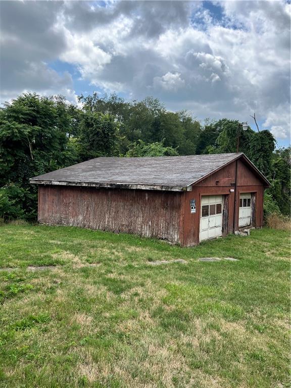 612 Highway 31 Ruffs Dale, PA 15679 - Photo 14 of 18 a view of a yard in front of a house with a yard