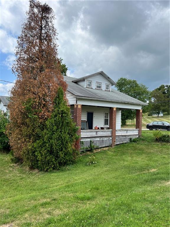 612 Highway 31 Ruffs Dale, PA 15679 - Photo 17 of 18 a view of a house with a garden and sitting area