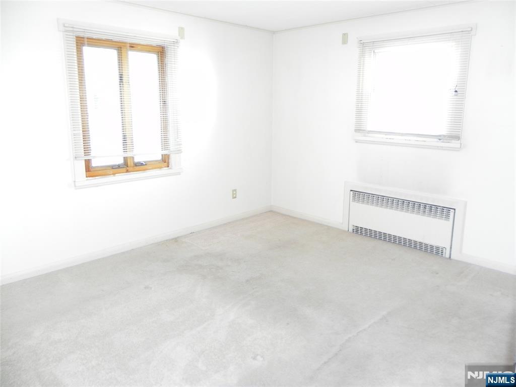 70 Christina Street Little Ferry, NJ 07643 - Photo 5 of 16 an empty room with a window