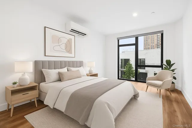 a bedroom with a bed and glass window