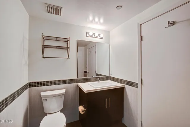 a bathroom with a shower and a toilet