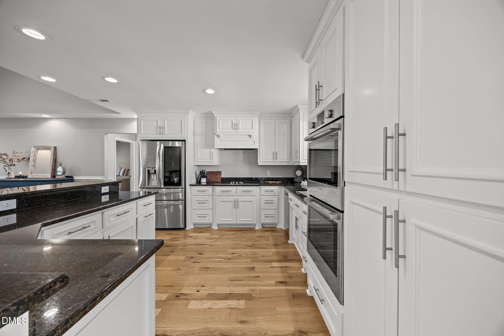 2079 Sheriff Johnson Road Lillington, NC 27546 - Photo 13 of 43 a large kitchen with stainless steel appliances granite countertop a refrigerator and a stove top oven