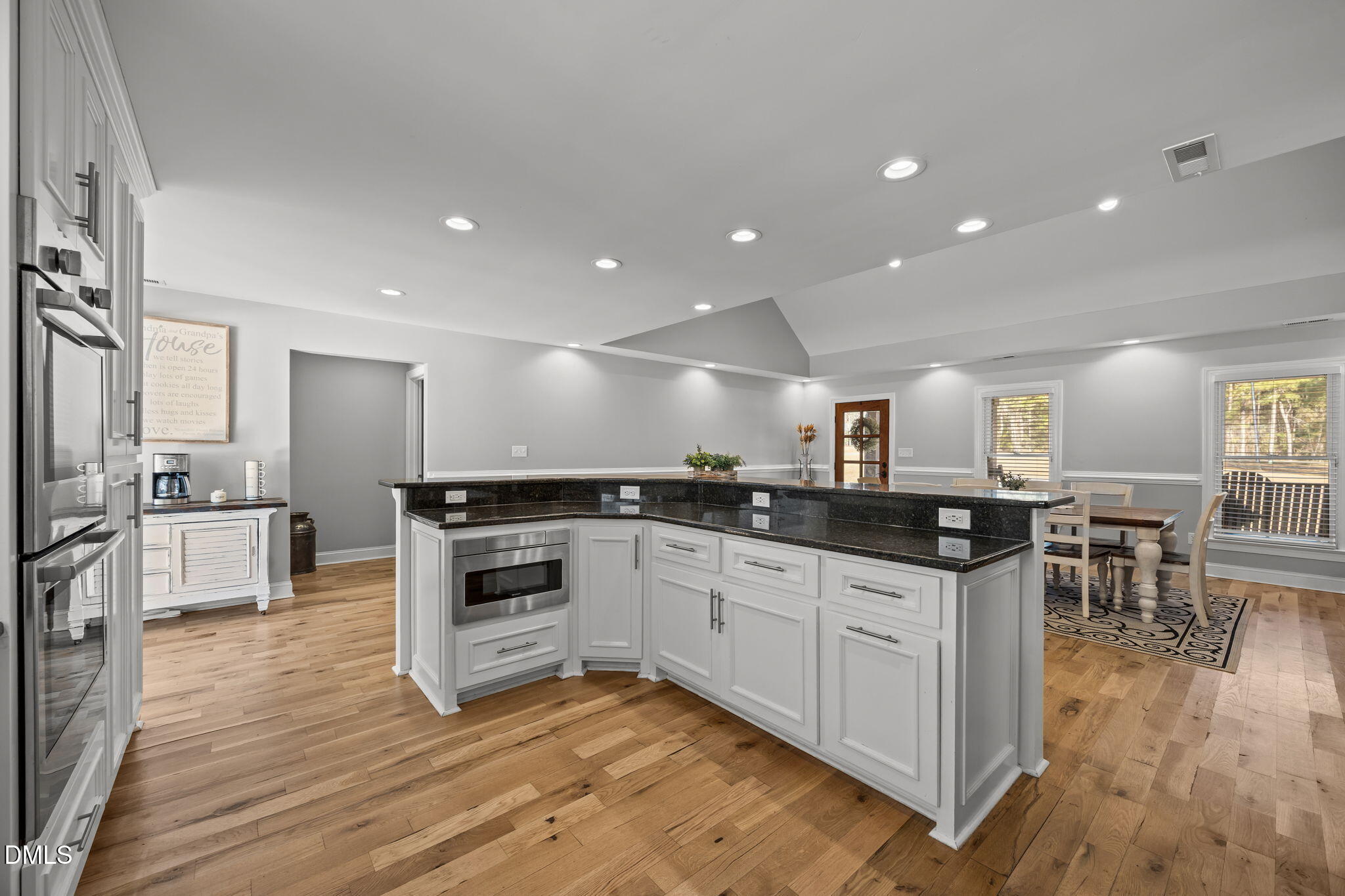 2079 Sheriff Johnson Road Lillington, NC 27546 - Photo 16 of 43 a kitchen with stainless steel appliances granite countertop a stove top oven a sink a counter space and cabinets