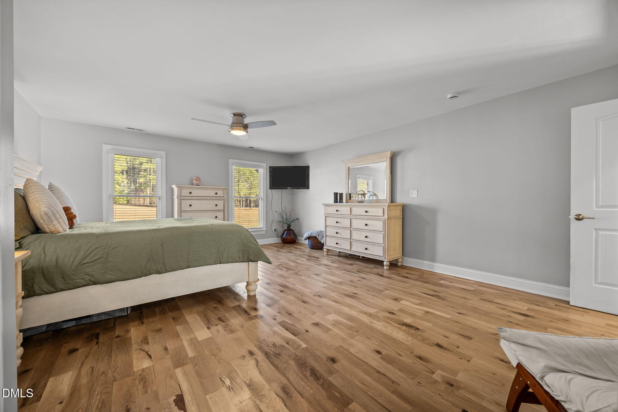 2079 Sheriff Johnson Road Lillington, NC 27546 - Photo 22 of 43 a bedroom with a bed and wooden floor