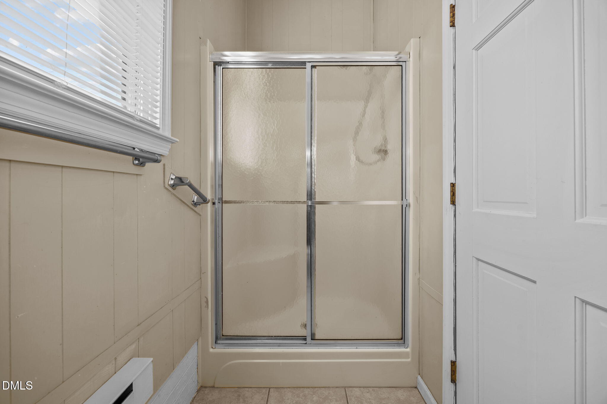 2079 Sheriff Johnson Road Lillington, NC 27546 - Photo 35 of 43 a bathroom with a glass shower door