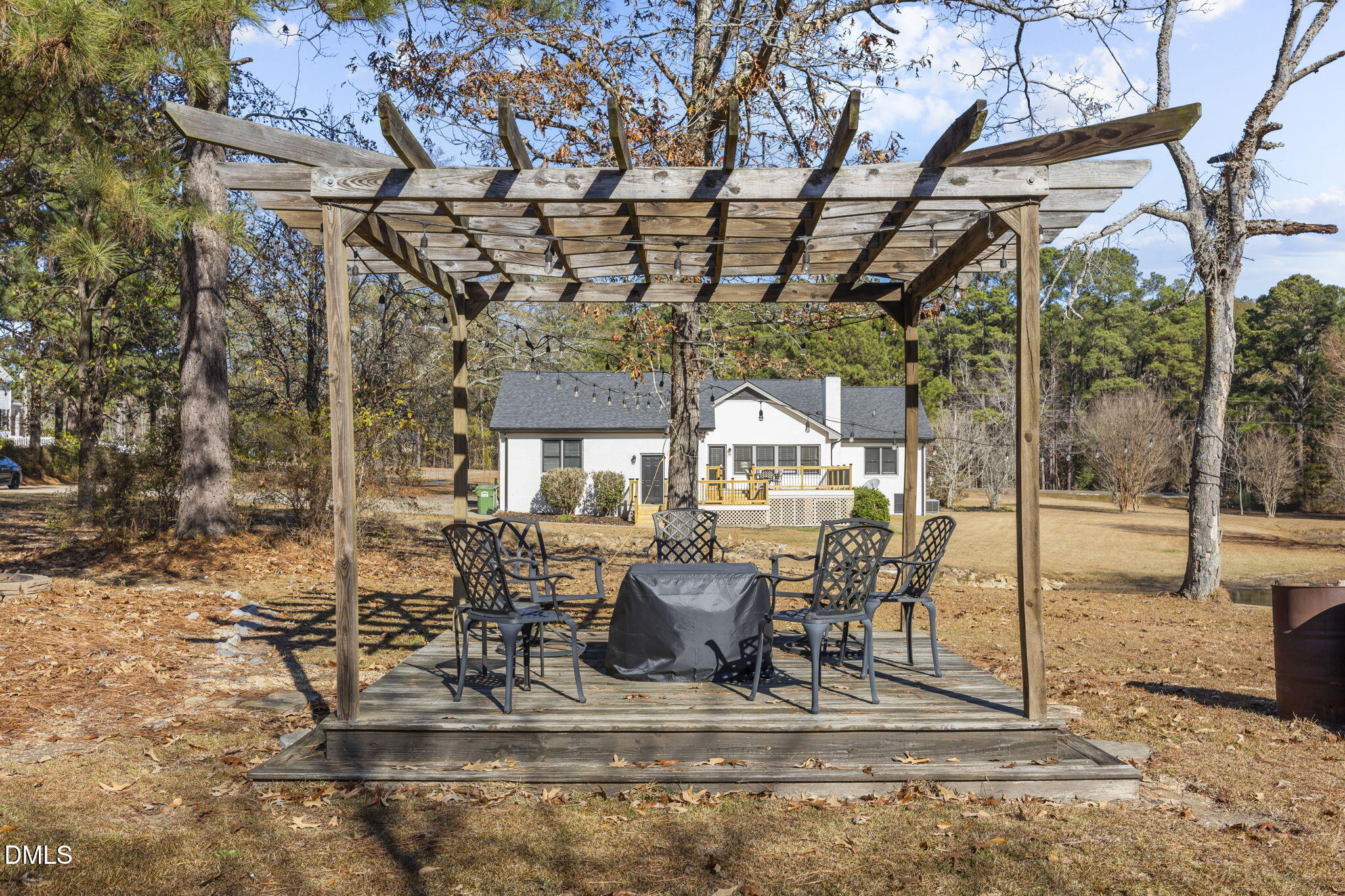 2079 Sheriff Johnson Road Lillington, NC 27546 - Photo 40 of 43 a view of a patio with table and chairs potted plants
