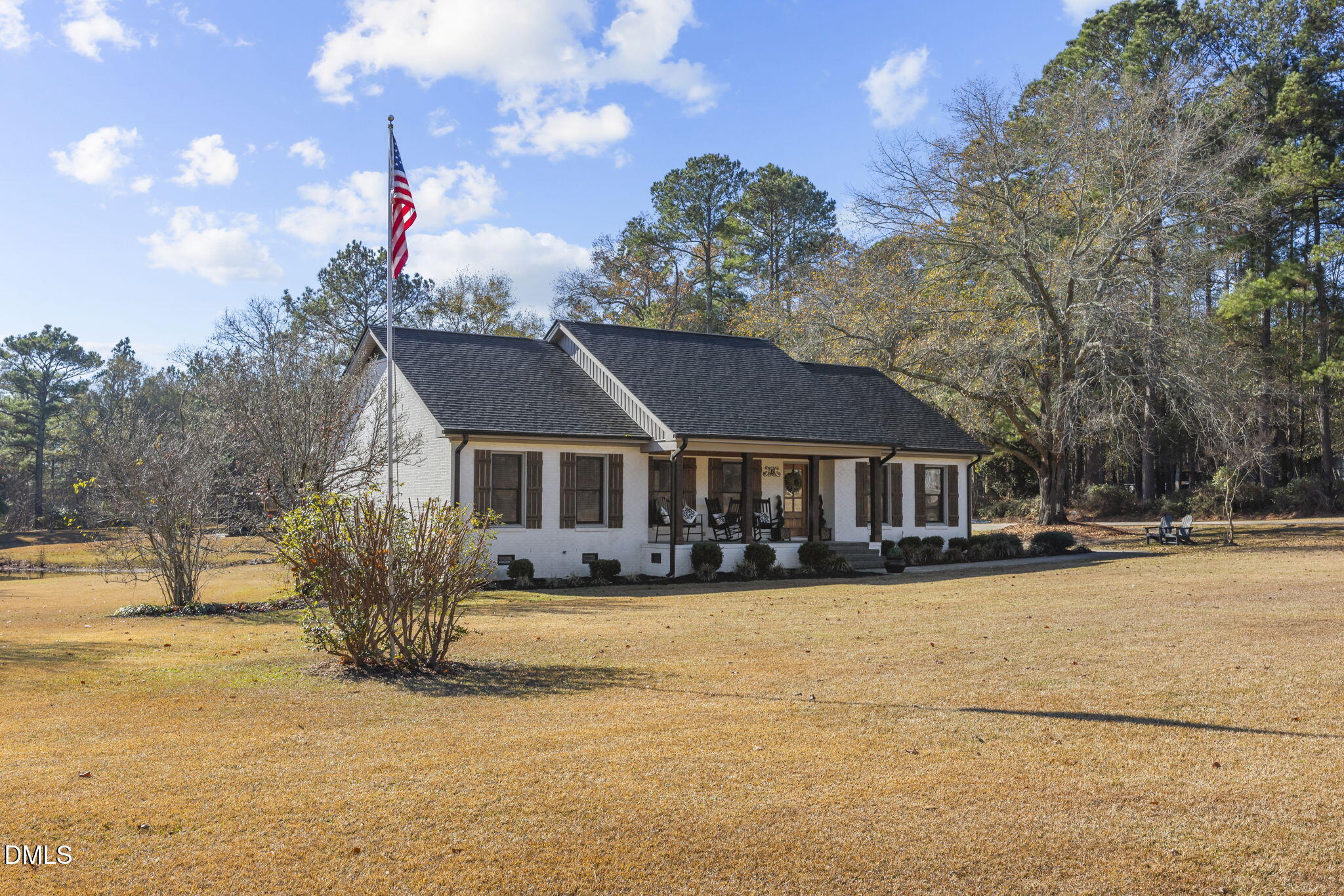 2079 Sheriff Johnson Road Lillington, NC 27546 - Photo 4 of 43 a front view of a house with a yard covered with snow and trees