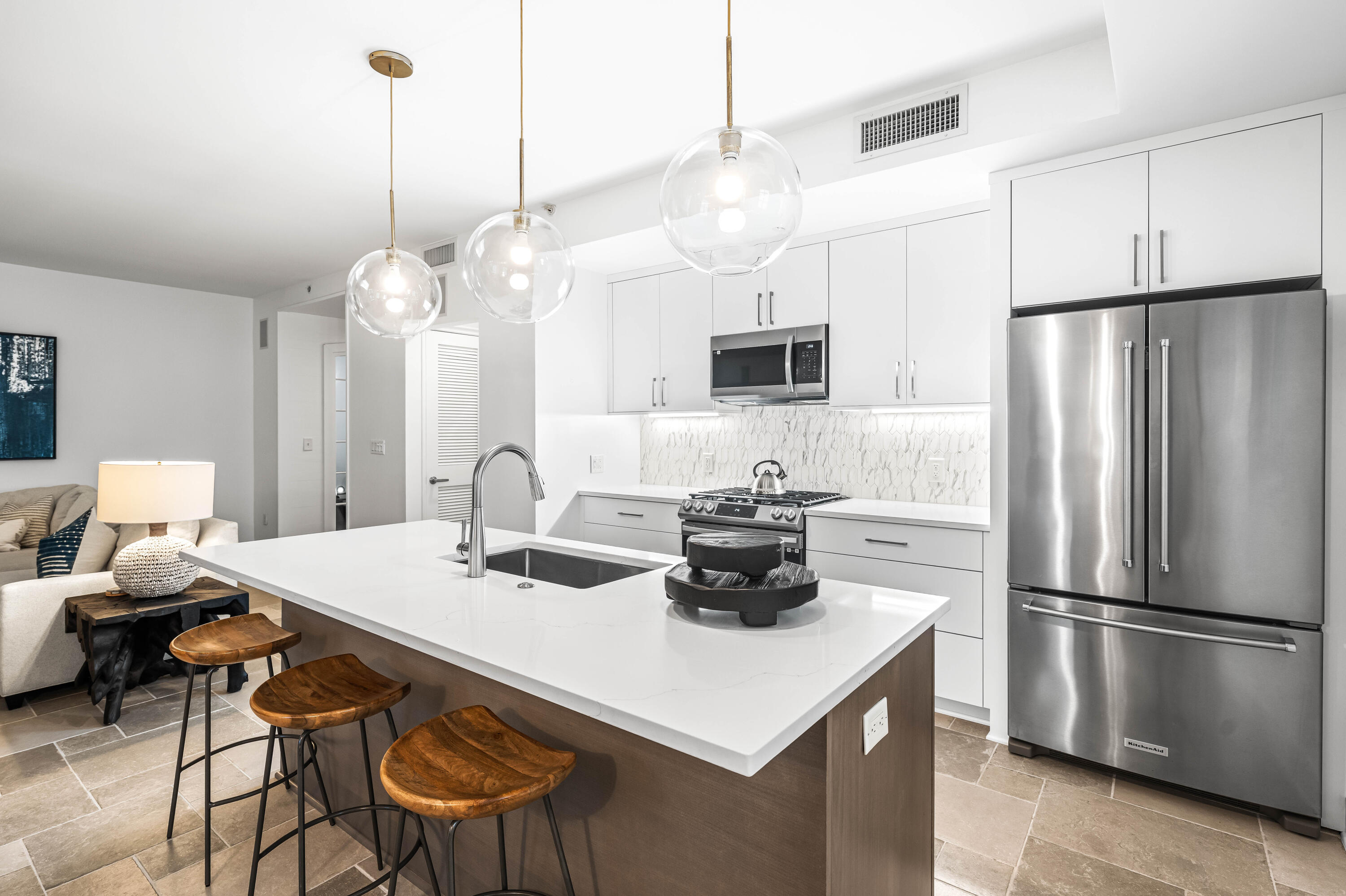 136 Georgetown Avenue, Unit 2D Inlet Beach, FL 32461 - Photo 11 of 48 a kitchen with a dining table and chairs