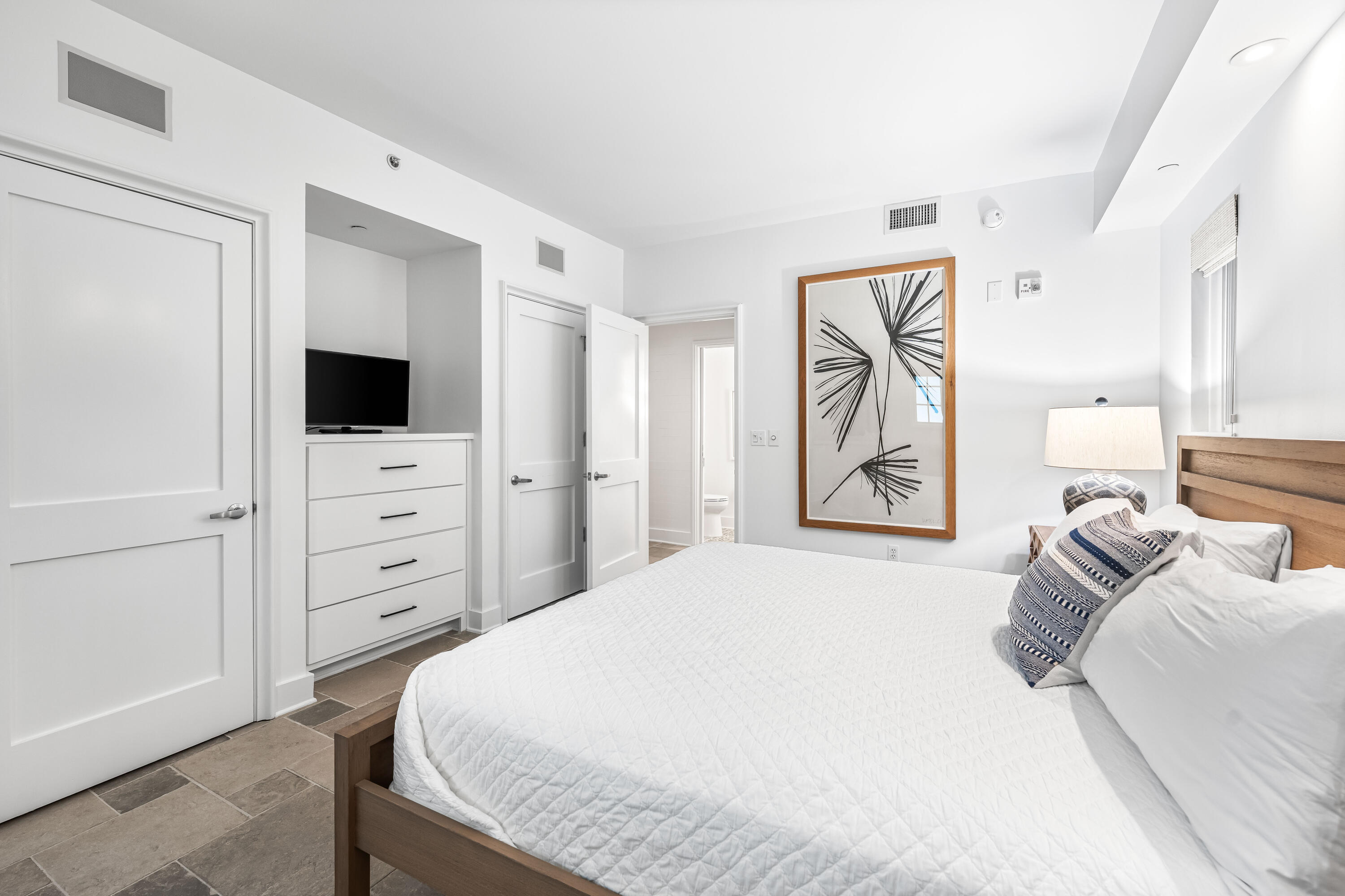 136 Georgetown Avenue, Unit 2D Inlet Beach, FL 32461 - Photo 22 of 48 a bedroom with a bed and a television