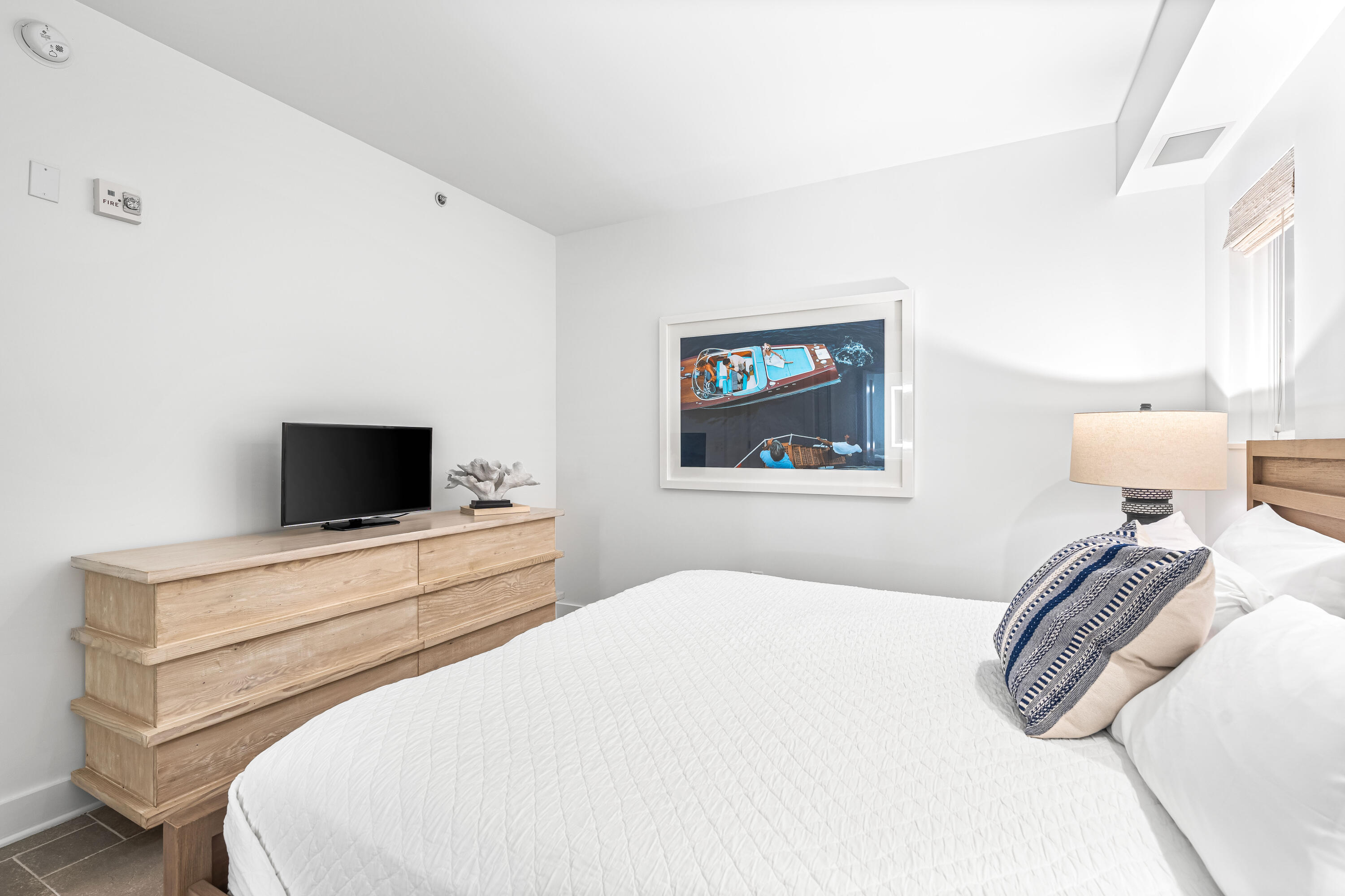 136 Georgetown Avenue, Unit 2D Inlet Beach, FL 32461 - Photo 27 of 48 a bedroom with a bed and a flat screen tv