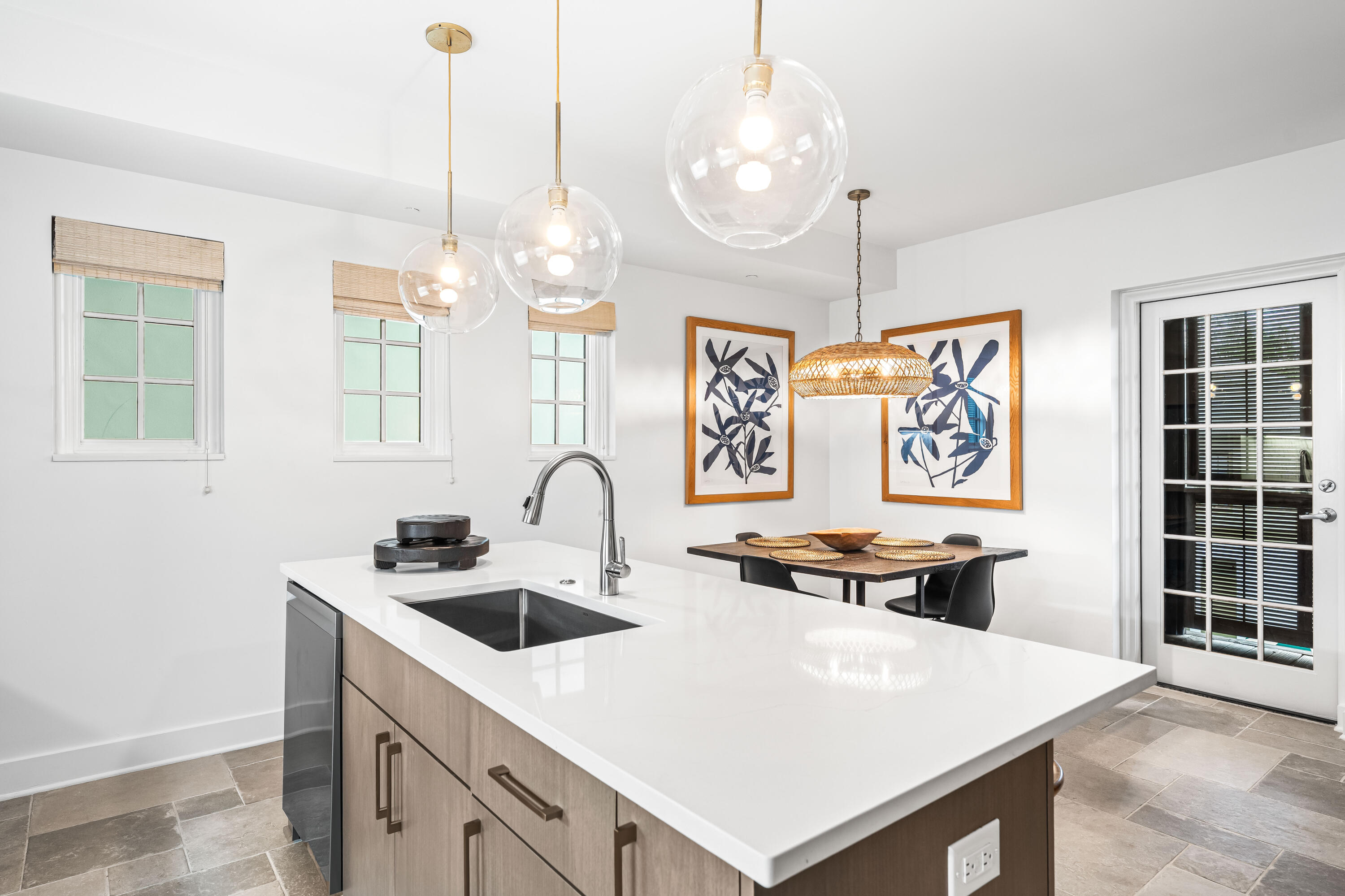 136 Georgetown Avenue, Unit 2D Inlet Beach, FL 32461 - Photo 8 of 48 a kitchen that has a cabinets a stove a sink a dining table and chairs