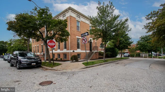 a view of a parked cars in front of a house