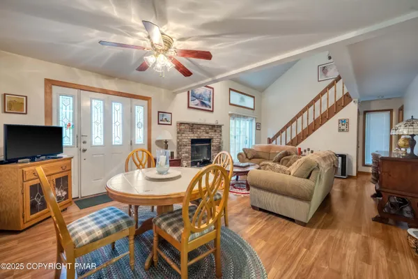 a living room with fireplace furniture and a flat screen tv