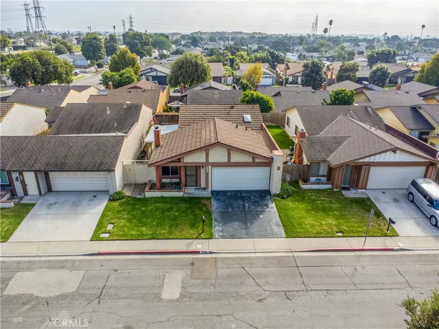 an aerial view of a house with a garden and plants