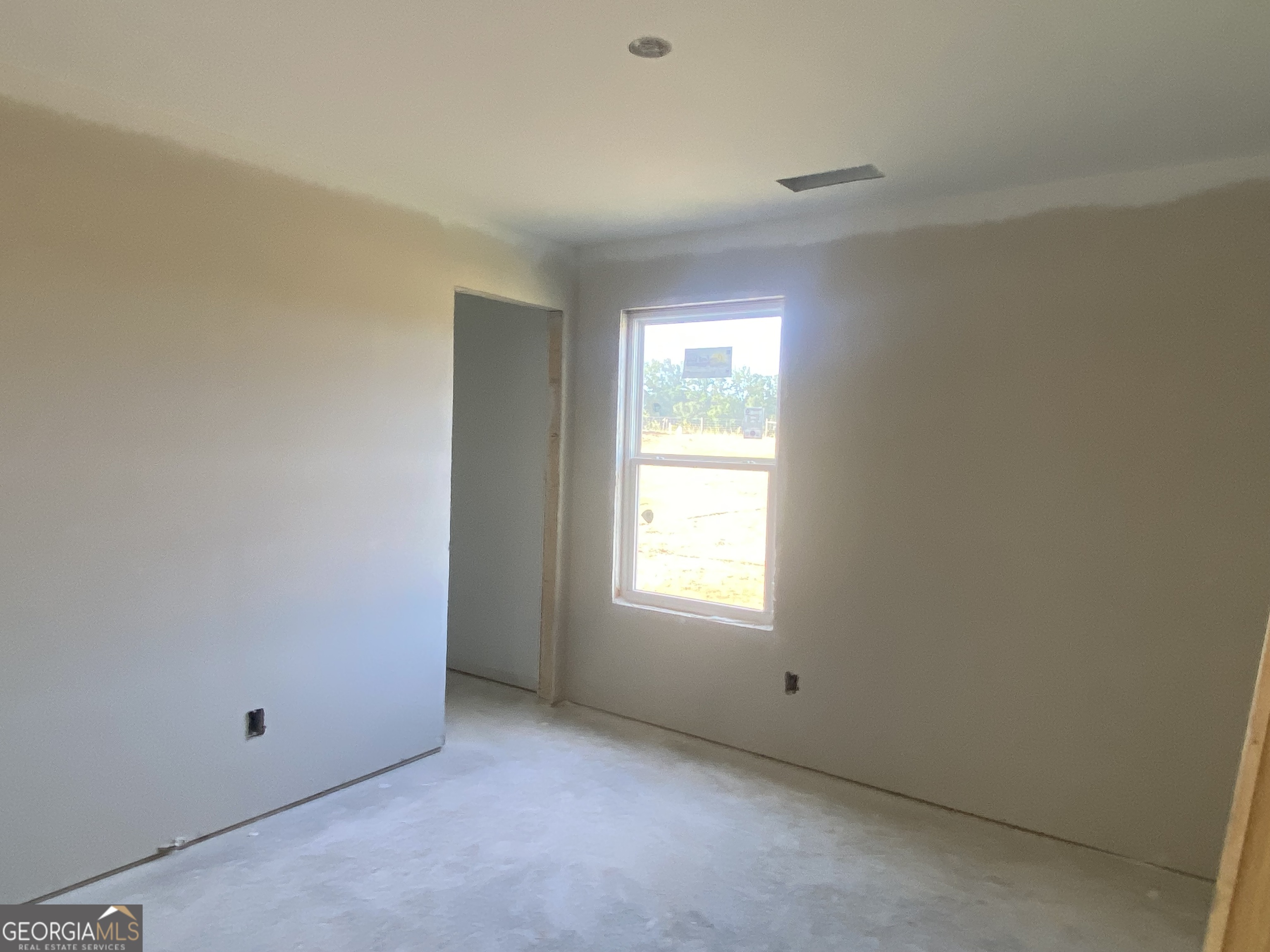 164 Mathews Road Milner, GA 30257 - Photo 11 of 15 an empty room with a window