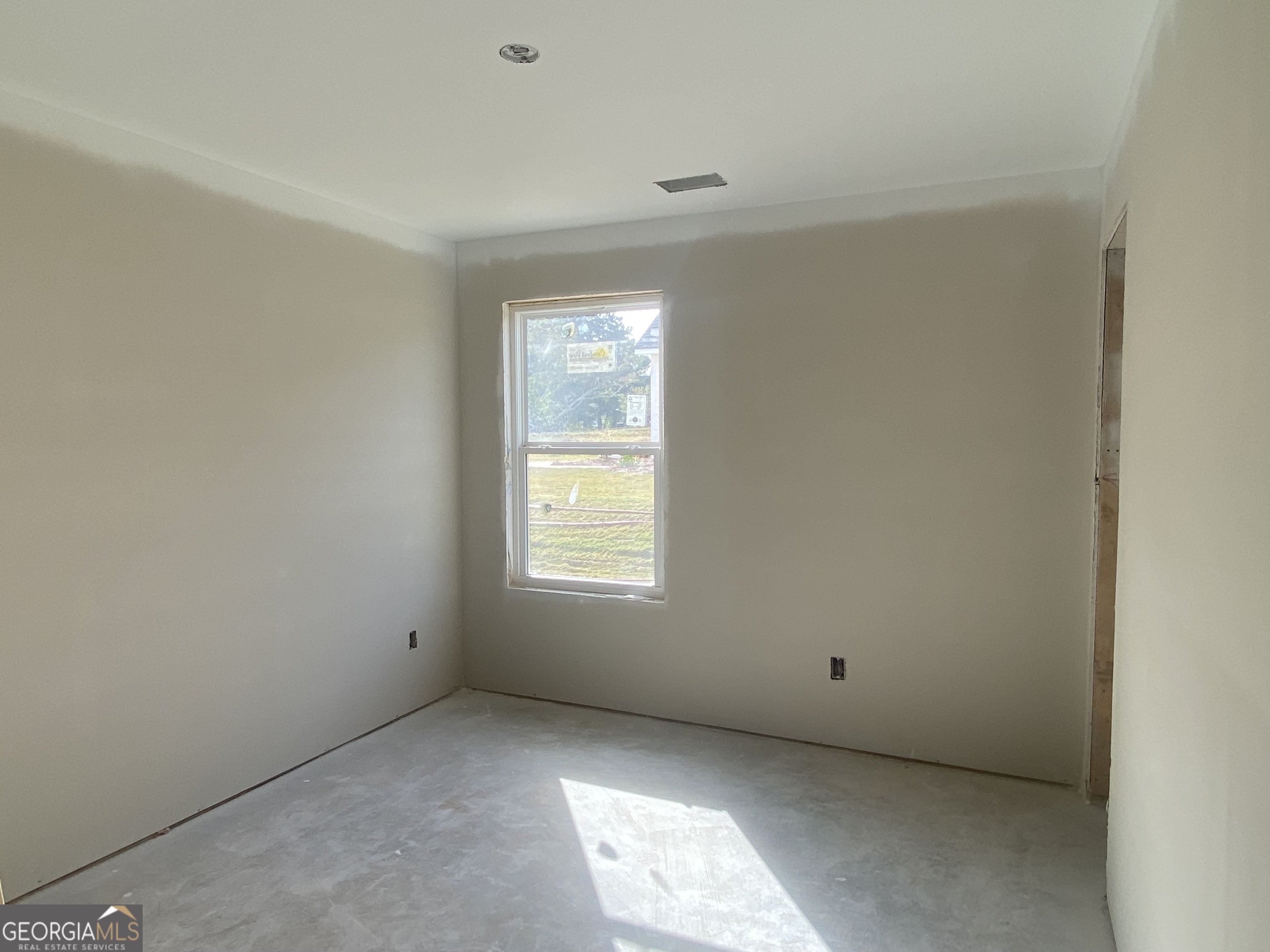 164 Mathews Road Milner, GA 30257 - Photo 13 of 15 an empty room with a window