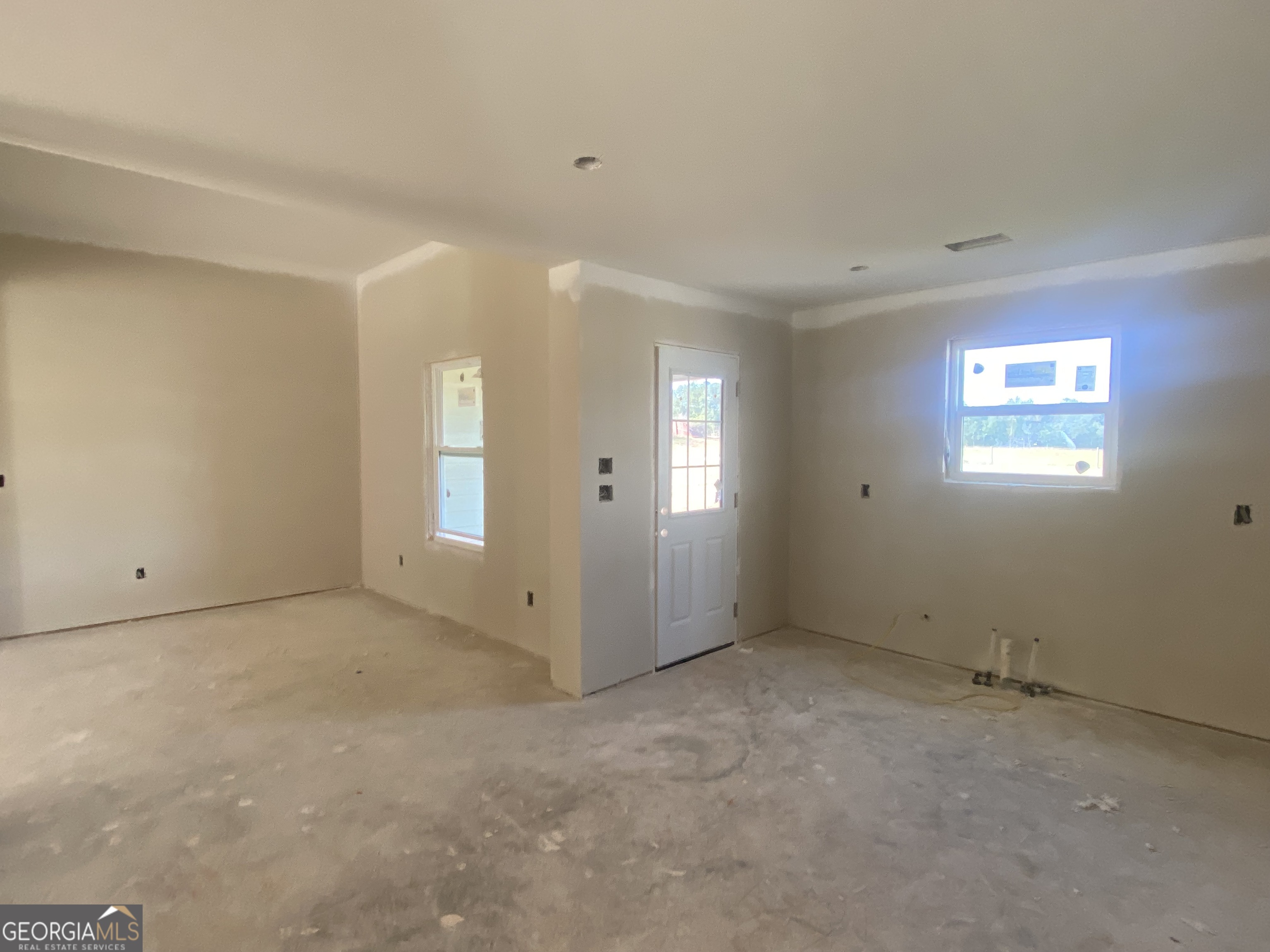 164 Mathews Road Milner, GA 30257 - Photo 5 of 15 an empty room with windows