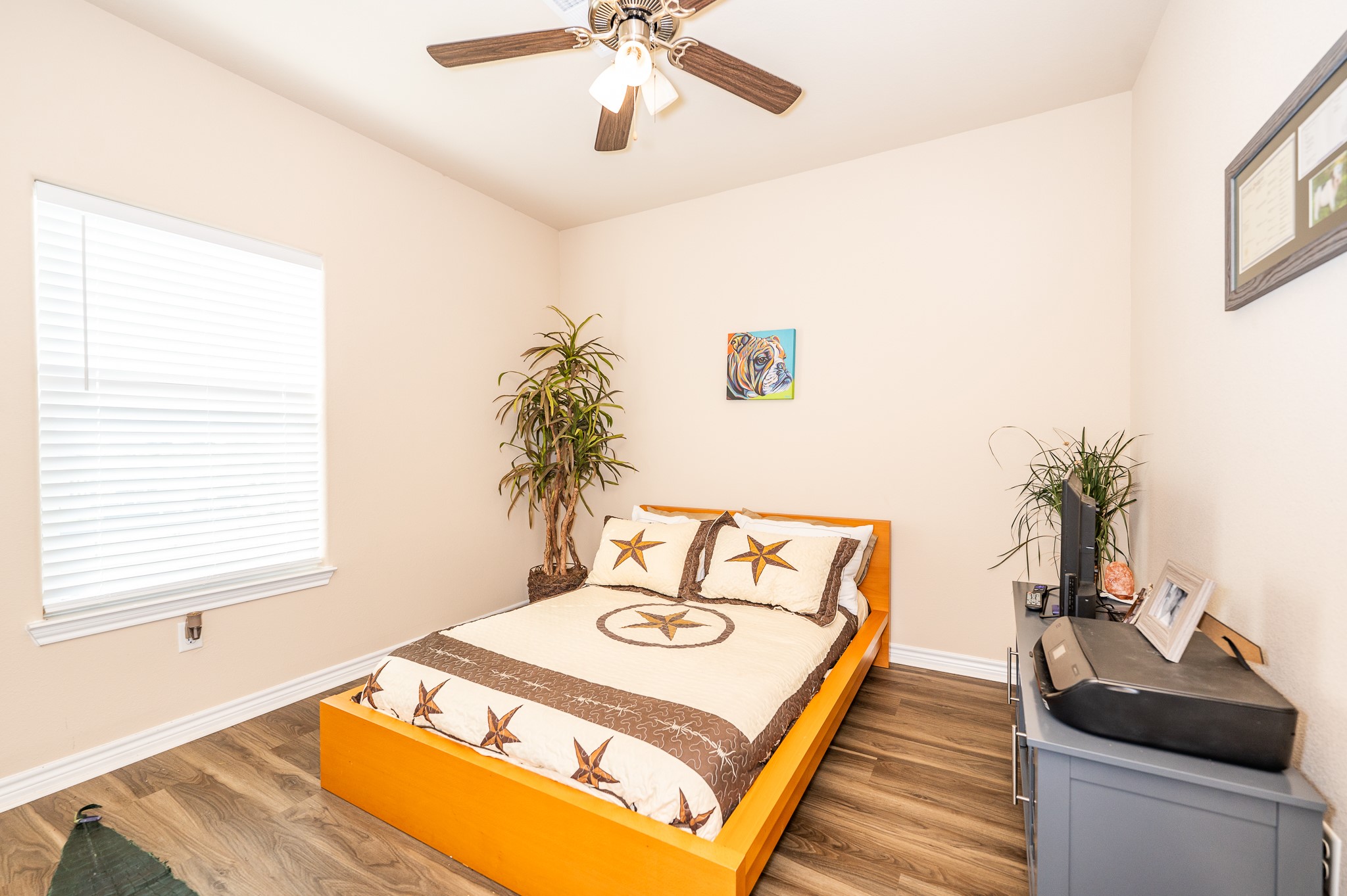 172 Curlew Street Sargent, TX 77414 - Photo 11 of 24 a living room with a bed furniture and a potted plant