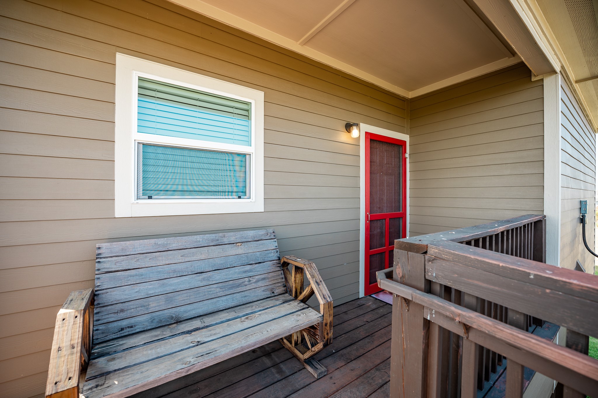 172 Curlew Street Sargent, TX 77414 - Photo 14 of 24 a view of a deck with wooden floor and a wooden fence