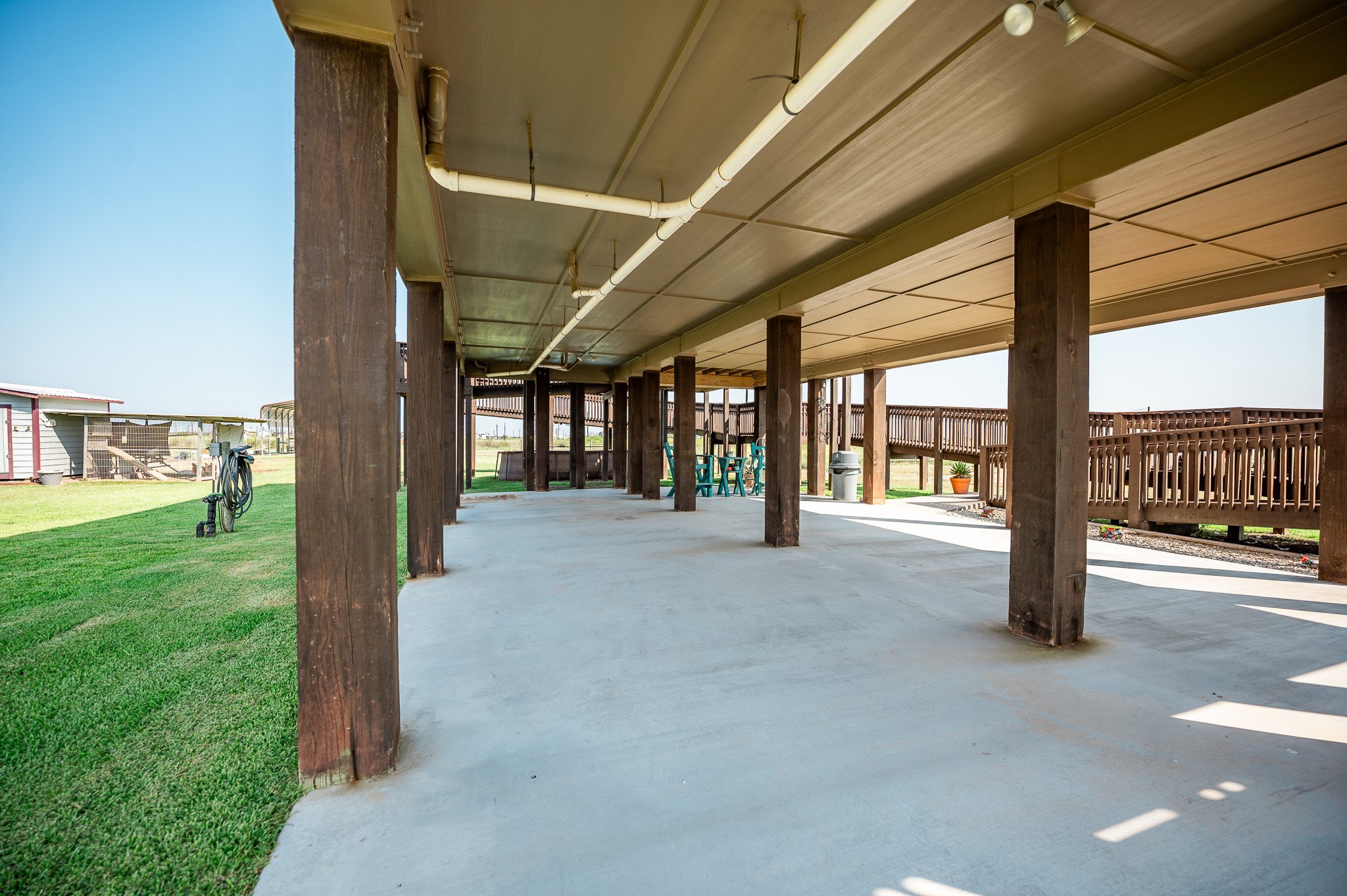 172 Curlew Street Sargent, TX 77414 - Photo 18 of 24 a view of a porch with furniture and garden