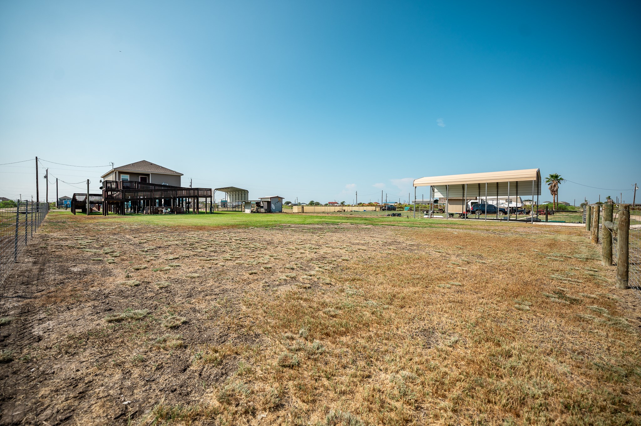 172 Curlew Street Sargent, TX 77414 - Photo 20 of 24 a tall building with view of a lake and trees