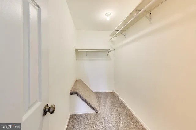 a white toilet sitting next to a bath tub
