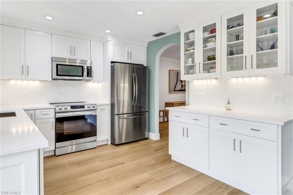 14 Rivard Road, Unit 7 Naples, FL 34112 - Photo 6 of 26 Solid wood cabinets with showcase glass & pull out drawers
