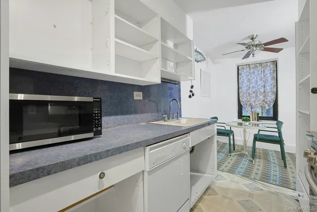 a kitchen with a stove and a microwave