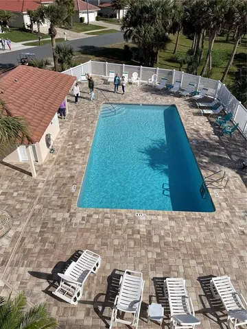 a large kitchen with kitchen island granite countertop a large counter top and chandelier