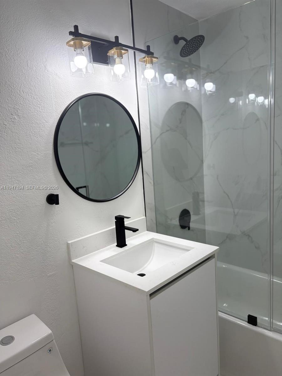 6104 Southwest 33rd Street Miramar, FL 33023 - Photo 11 of 31 a bathroom with a sink and a mirror