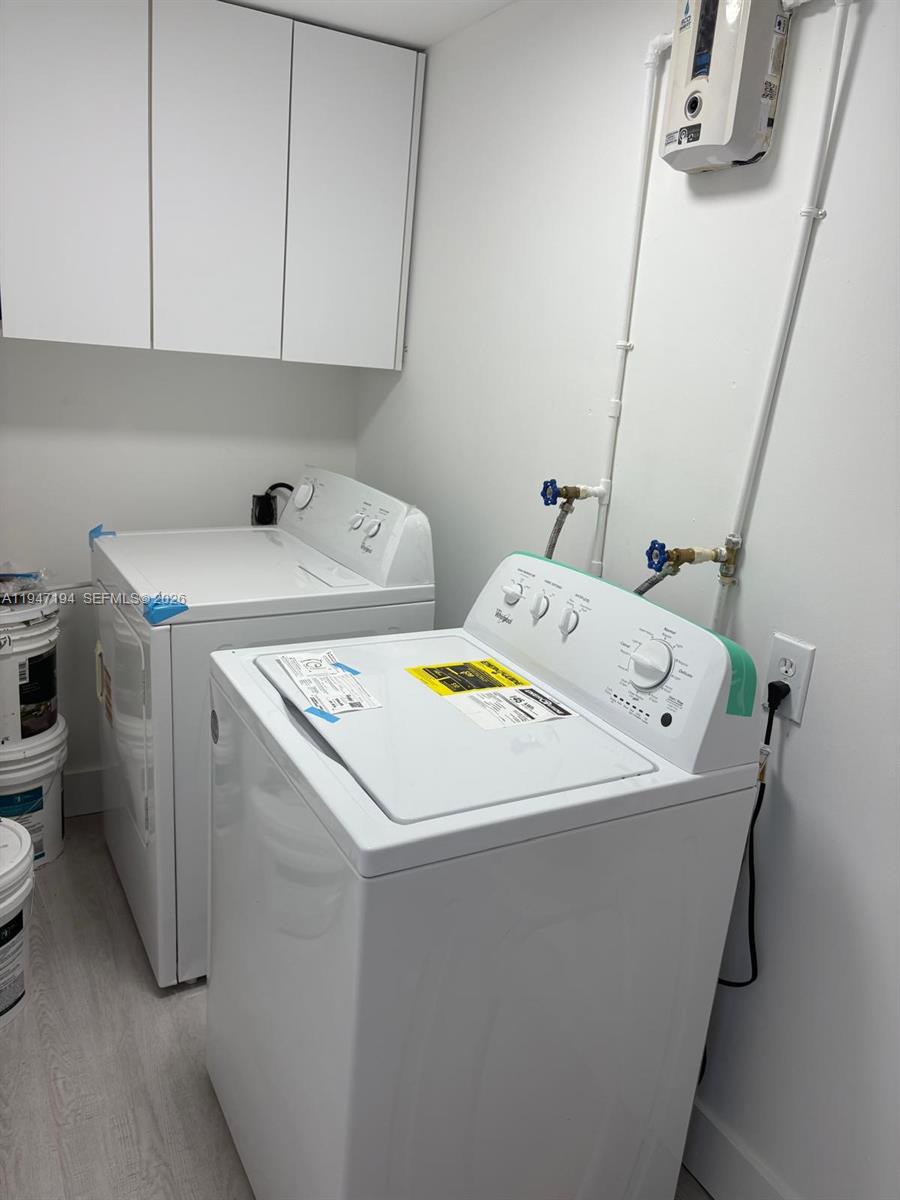 6104 Southwest 33rd Street Miramar, FL 33023 - Photo 22 of 31 a utility room with dryer and washer